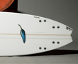 Name: C-Quad - The Chilli C-Quad is what happens when you combine old concepts with modern advancements in surfboard shaping, mixing the best variables of performance enhancements in the ultimate quad. Image by Chilli Surfboards