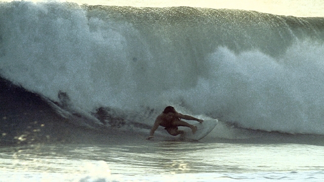 surfer grabbing rail on a right