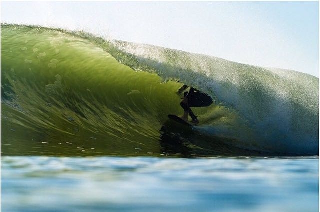 surfer in a tight barrel